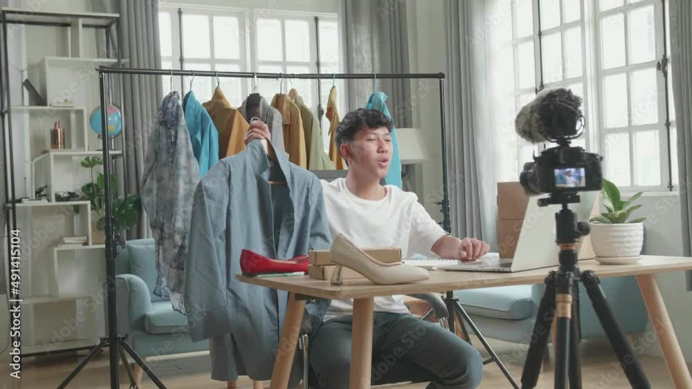 Asian Young Man Read Comment On Computer And Recording Video By Camera For Selling Clothes Online At Home
Asian Young Man Read Comment On Computer And Recording Video By Camera For Selling Clothes Online At Home
