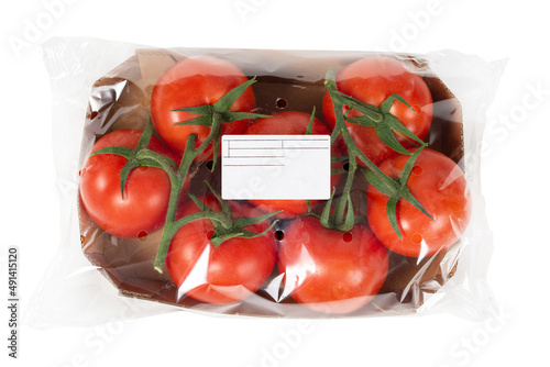 Принти на полотні Freshly harvested tomatoes packaged and labeled on isolated white background