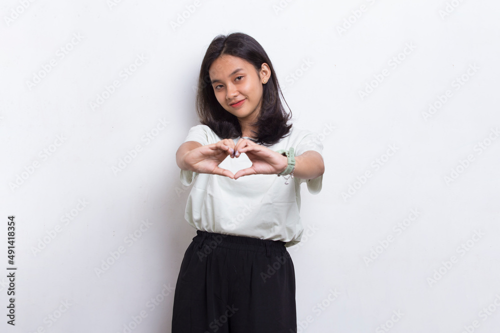 asian beautiful young woman showing heart sign love isolated on white background
asian beautiful young woman showing heart sign love isolated on white background
