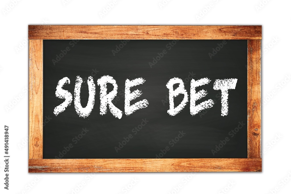 SURE BET text written on wooden frame school blackboard. SURE BET text written on wooden frame school blackboard.