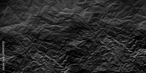Black crumpled paper. Texture  dark background.