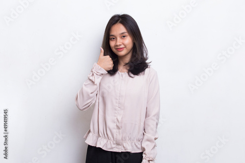 young asian beautiful woman with ok sign gesture tumb up isolated on white background 