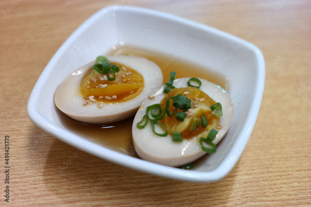 Egg paste made with soy sauce on a square plate. Egg paste made with soy sauce on a square plate.