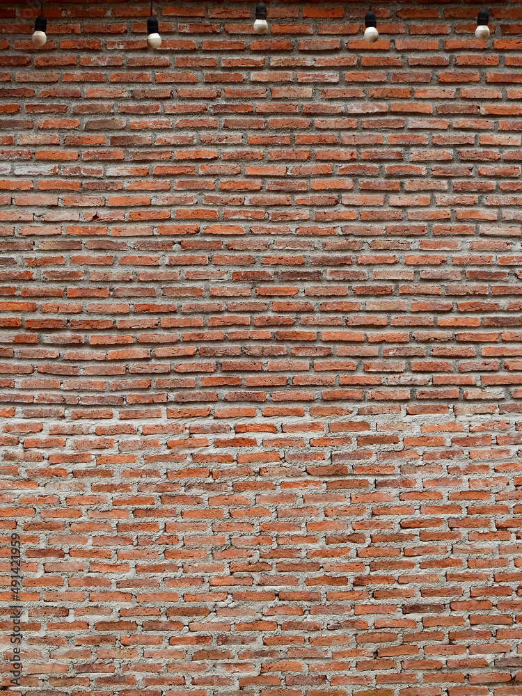 old brick wall with hanging light bulb old brick wall with hanging light bulb