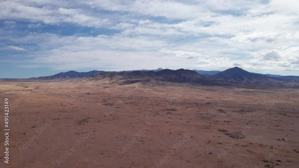 Drone shot panning right to left over the New Mexico desert on a sunny day Drone shot panning right to left over the New Mexico desert on a sunny day