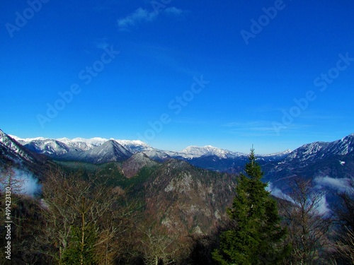 View of mountains in Karavanke mountains in Gorenjska region of Slovenia above Jezersko, Slovenia in winter with the peaks covered in snow