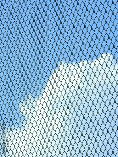 wire mesh of fence with blue sky background photo