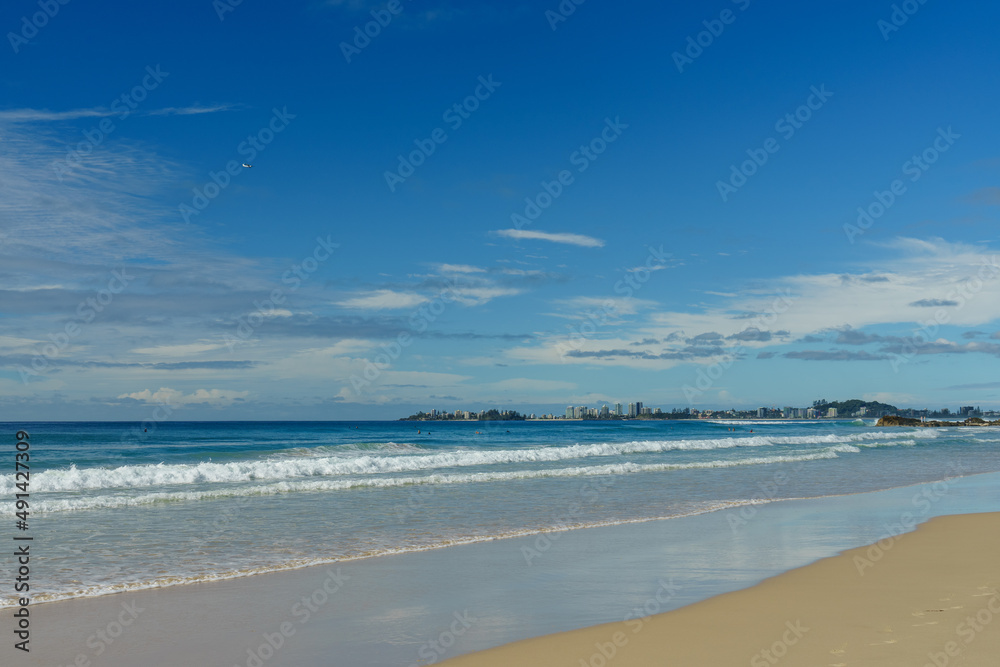 View to the south along the shoreline at Currumbin Beach to Coolangatta in the distance. Gold Coast, Queensland, Australia.