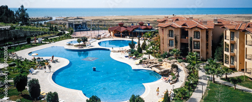 Fototapeta Naklejka Na Ścianę i Meble -  Luxury hotel with swimmingpool. Turkey Antalya. Panorama. Coast. Mediterranean Sea.
