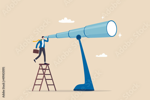 Long term plan or business strategy for far future, looking for opportunity, forecast and visionary, discover long term goal concept, businessman looking through oversized long telescope to see future photo