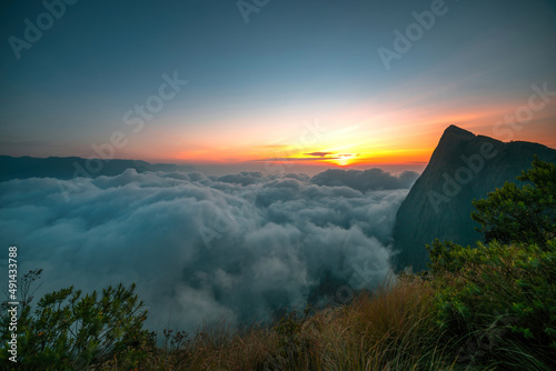 Breath-taking sunrise view over the mountains with foggy landscape shot from Munnar Kolukkumalai, Indian Travel and tourism image