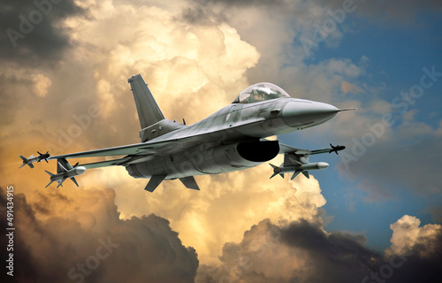 Modern fighter jet (model) against dramatic clouds