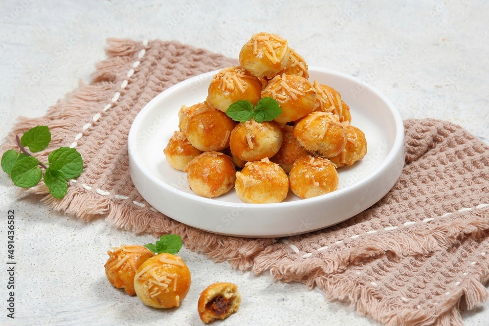 Pineapple tart or nanas tart or nastar cookies. cookies with pineapple jam inside on bright mood Pineapple tart or nanas tart or nastar cookies. cookies with pineapple jam inside on bright mood