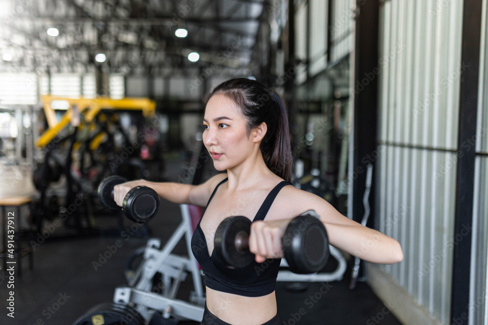 exercise concept The exercising starter giving a focus on working on dumbbells by doing core stabilization with both arms exercise concept The exercising starter giving a focus on working on dumbbells by doing core stabilization with both arms