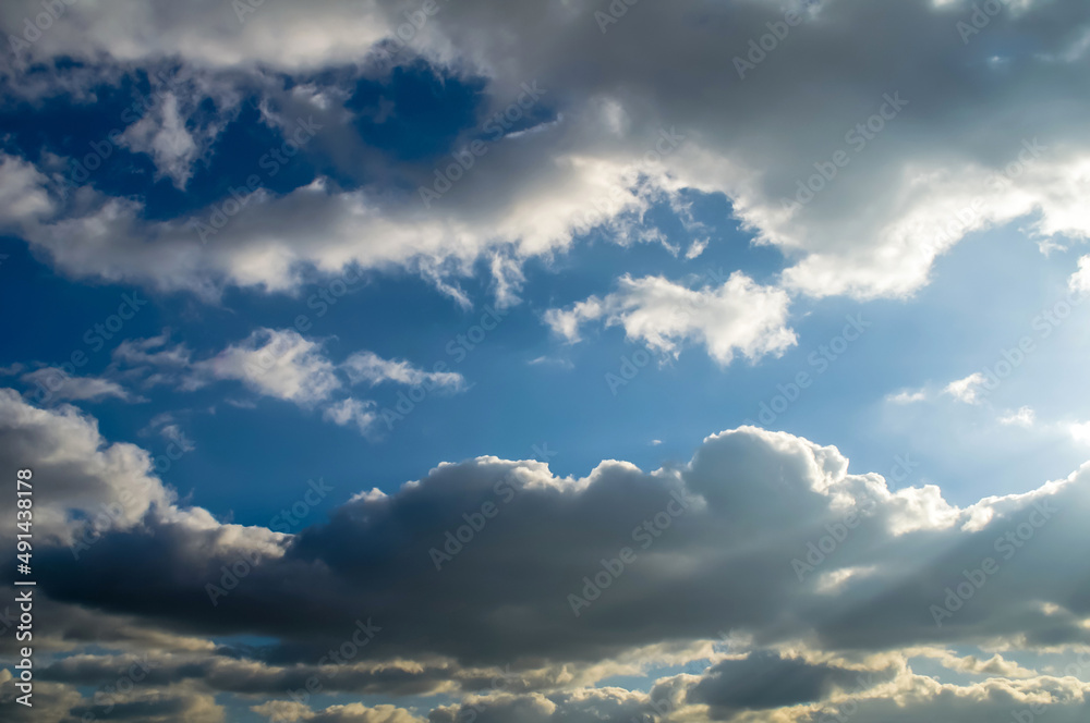 fluffy clouds and blue sky,arranged in an interesting form fluffy clouds and blue sky,arranged in an interesting form
