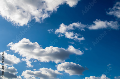 fluffy clouds and blue sky,arranged in an interesting form