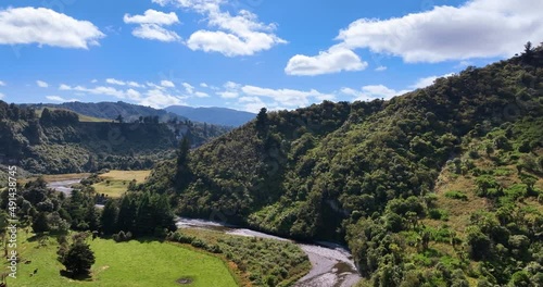 Flying over Manawatu's Oroua River with fields, cliffs, and forest - NZ photo