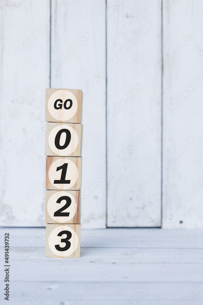 go word or concept on wooden blocks, white wood background go word or concept on wooden blocks, white wood background