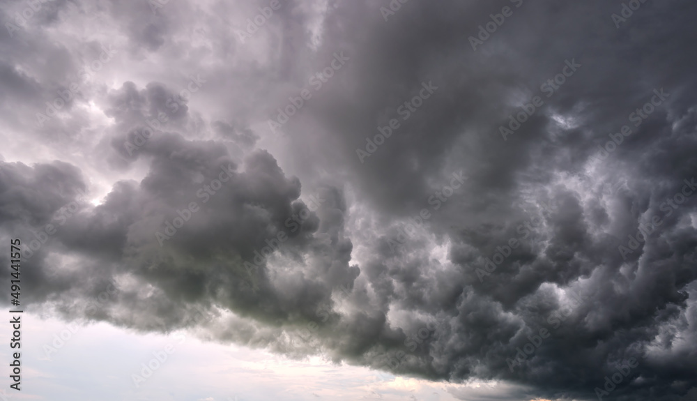 Landscape of dark ominous clouds forming on stormy sky during heavy thunderstorm Landscape of dark ominous clouds forming on stormy sky during heavy thunderstorm