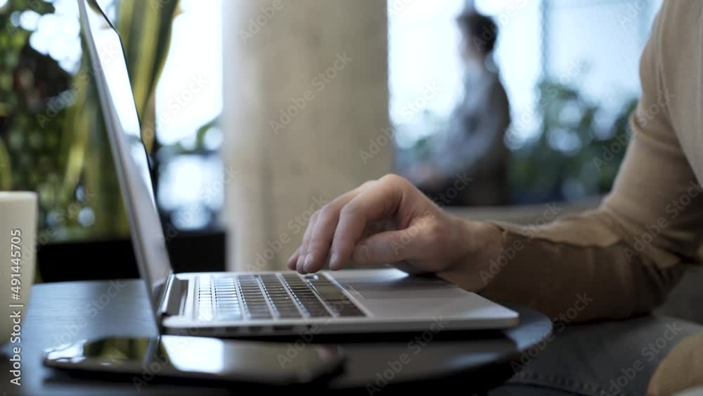 Businessman hits the enter key to send completed file, do upload action, finish work project, send letter, save file or do another concluding action. Businessman hits the enter key to send completed file, do upload action, finish work project, send letter, save file or do another concluding action.