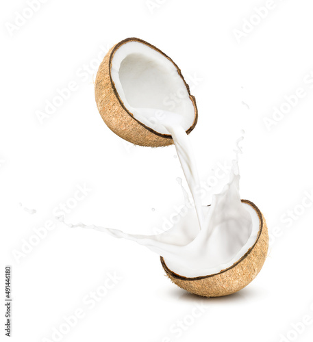 Coconut milk pouring and splashing isolated on white background.
