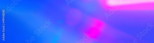 Ray light of pink and purple color. Blue Fluid blurred shine abstract Neon glowing techno lines. Defocused and Blurred bright Ultraviolet light. Modern neon with bokeh defocused lights