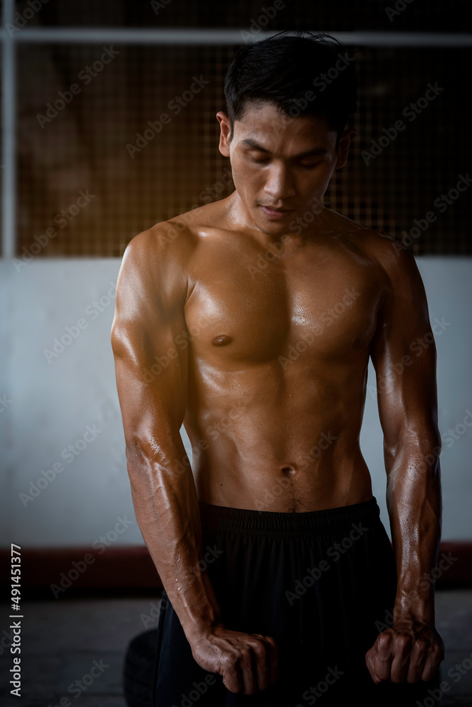 Fitness man exercise training warm up body and posing in gym,Healthy lifestyle.