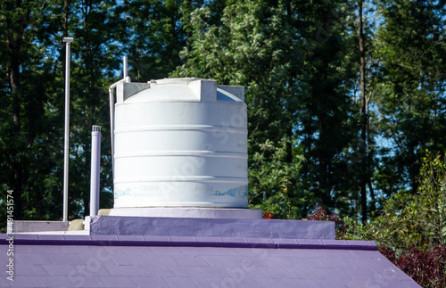 View of overhead water tank for storing the water needs for the house.