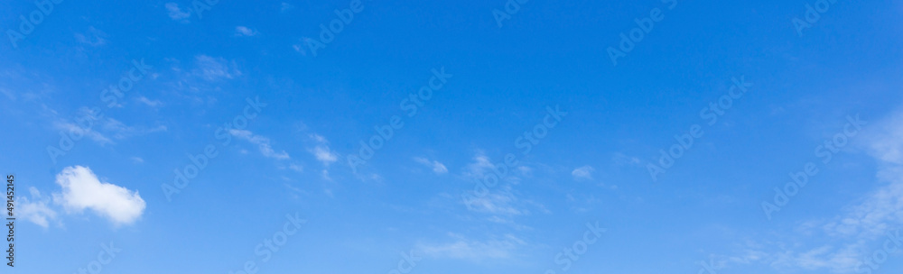 Cloudy blue sky background on sunny day