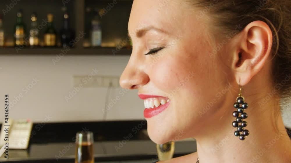A female is talking to a friend at the bar in Goa. In slow motion A female is talking to a friend at the bar in Goa. In slow motion