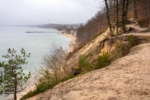 Subsiding slope of Klif Orlowski Cliff - loess steep shore undermined by Baltic Sea waves in Gdynia Orlowo in Pomerania region of Poland photo
