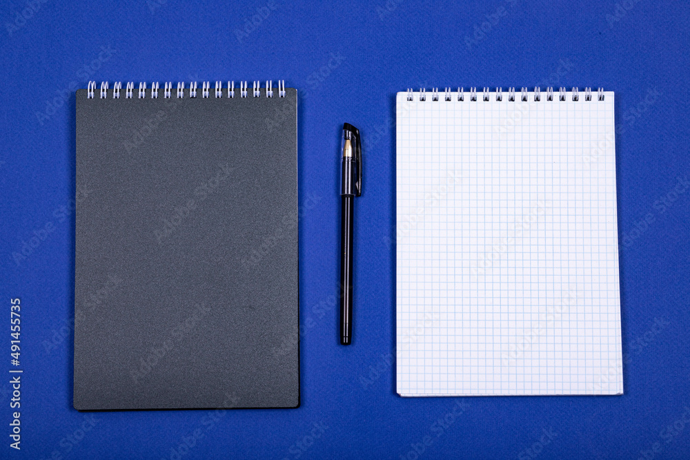 School spiral notebook isolated on a blue background School spiral notebook isolated on a blue background