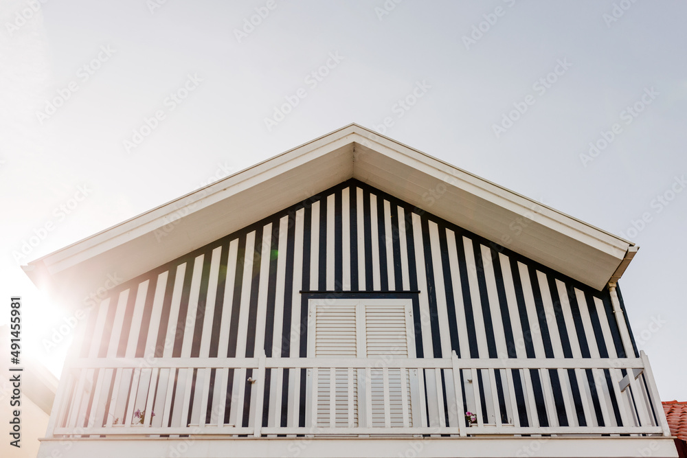 Colorful striped wooden beach houses at the promenade of Costa Nova, Aveiro, Portugal Colorful striped wooden beach houses at the promenade of Costa Nova, Aveiro, Portugal