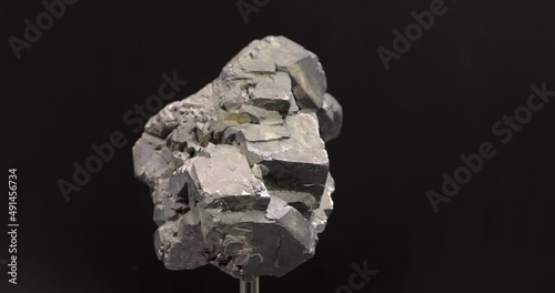 rotation of Crystal of galenite on black background