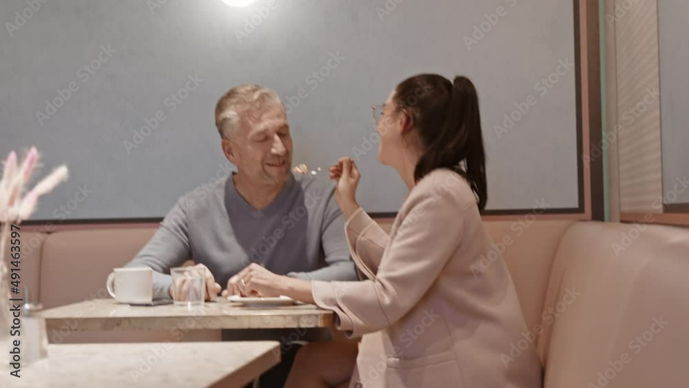 Romantic business couple meeting at coffee and cake in a cafe Romantic business couple meeting at coffee and cake in a cafe