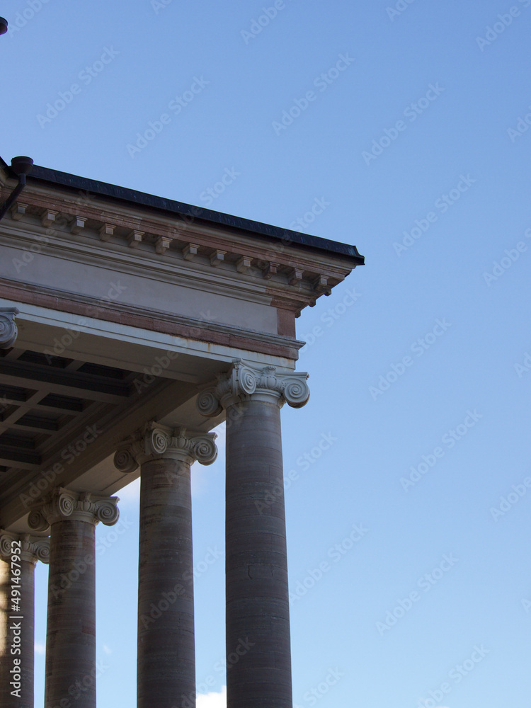 Building with Roman pillars and blue sky