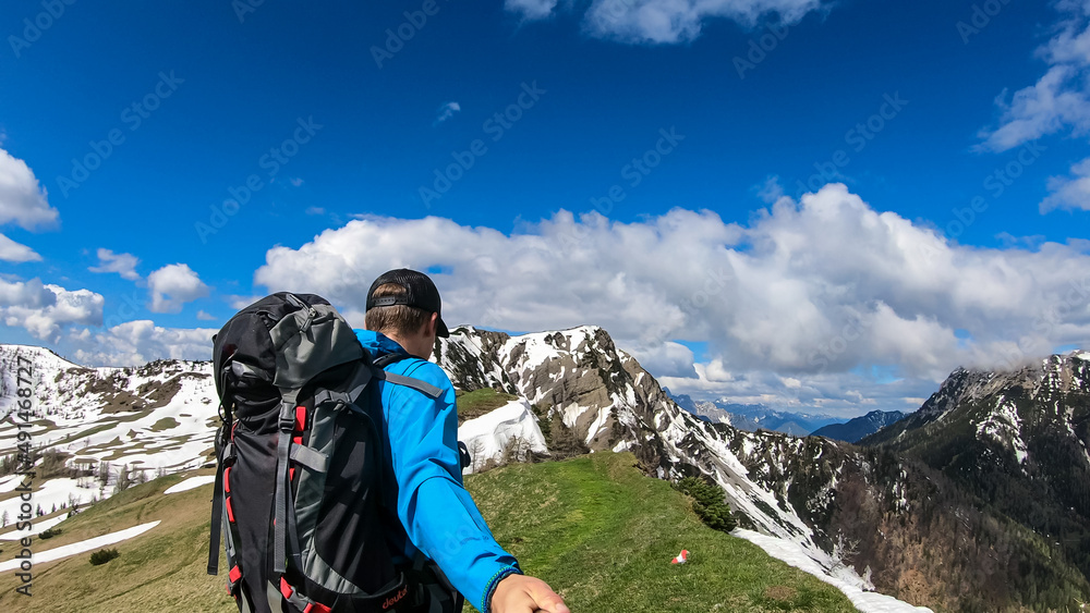 Man taking selfies and hiking to the Frauenkogel (Dovska Baba) with scenic view on the Karawanks, Carinthia, Austria. Borders Austria, Slovenia, Italy. Triglav National Park. Mount Triglav and Mangart Man taking selfies and hiking to the Frauenkogel (Dovska Baba) with scenic view on the Karawanks, Carinthia, Austria. Borders Austria, Slovenia, Italy. Triglav National Park. Mount Triglav and Mangart