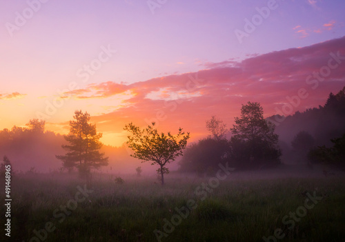 A beautiful spring sunrise with dramatic  colorful sky. Seasonal scenery of Northern Europe.
