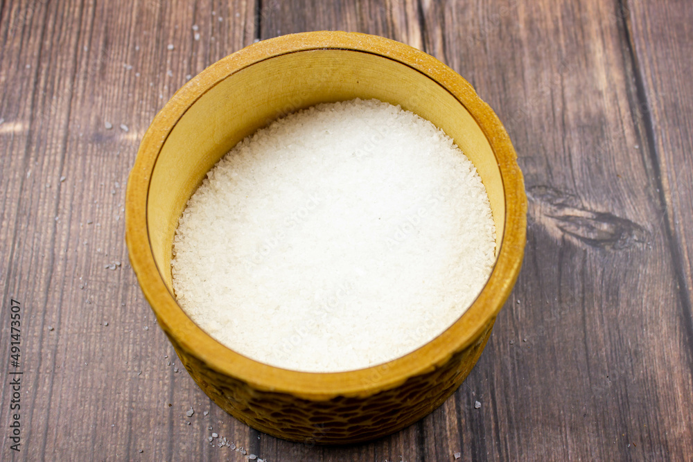 Seasoning salt. Salt is natural. Salt in a wooden box. Salt and hands. Seasoning salt. Salt is natural. Salt in a wooden box. Salt and hands.