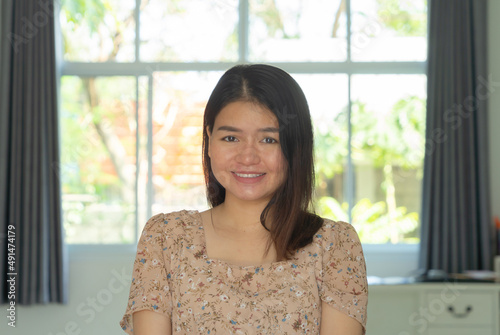 Free Download Portrait of smiling business Asian woman, Thai person working from home, talking to her colleagues in webcam group video call conference online in quarantine in coronavirus pandemic. - GFXLoad