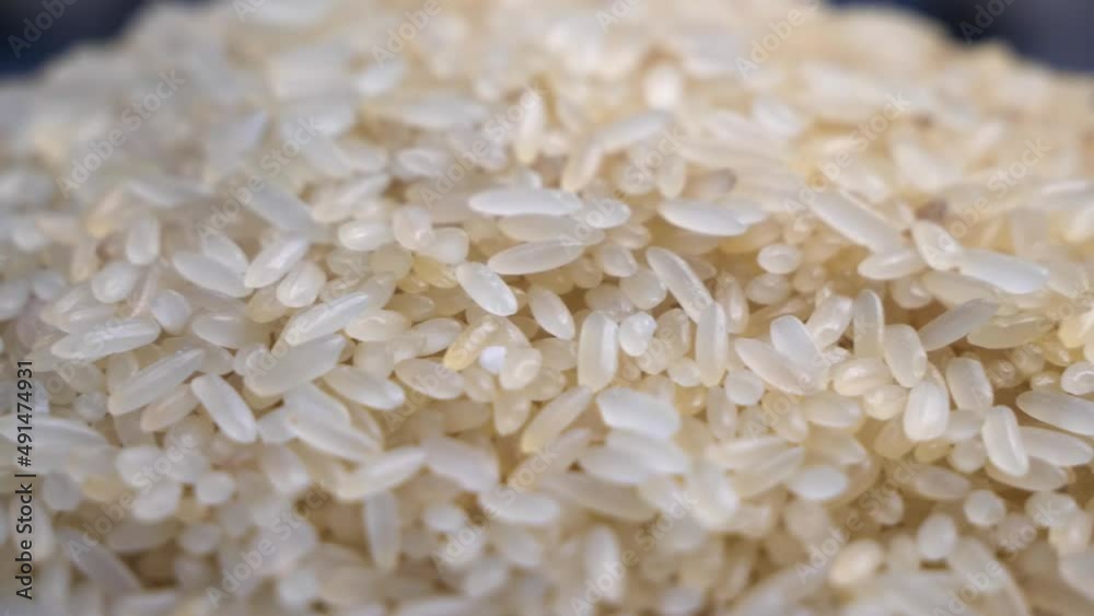 Closeup view video of white uncooked rice rotating. Side view.
Closeup view video of white uncooked rice rotating. Side view.