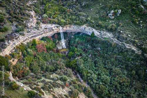 Prastio waterfall in Cyprus created by the high rain season, drone panorama