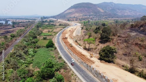 Aerial view of traffic on the Mumbai Goa highway undergoing upgrades and enhancement near Mahad, India. The highway is officially designated as NH 66. photo