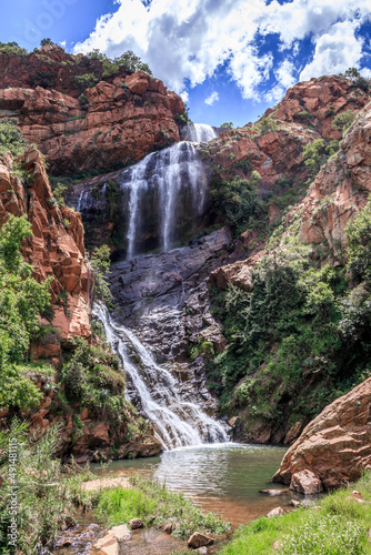 View of a waterfall and river in a mountainous area in Walter Sisulu National botanical gardens, Johannesburg, South Africa