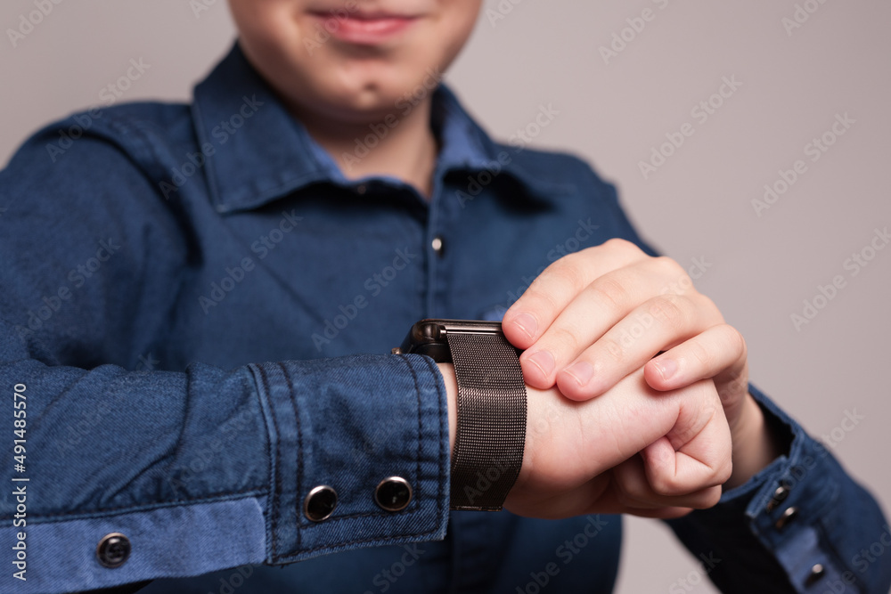 hand of a guy with a smart watch on his wrist. close-up