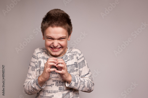 a boy with a sinister mean expression