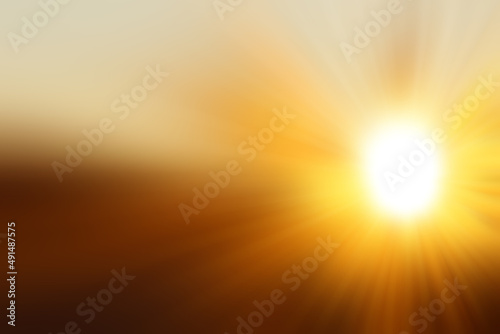 Abstract blured golden background with a flash and diverging rays on the right side