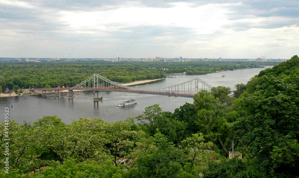 Kyiv or Kiev, Ukraine: Dnieper River and Park Bridge seen from Vladimiro kalva or Saint Volodymyr Hill near to Volodymyr the Great Monument. Kyiv or Kiev, Ukraine: Dnieper River and Park Bridge seen from Vladimiro kalva or Saint Volodymyr Hill near to Volodymyr the Great Monument.