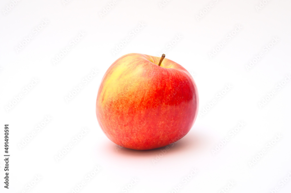Red apple on a white background with a shadow. Red apple on a white background with a shadow.