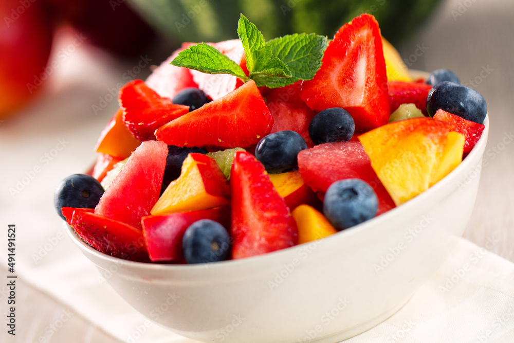 Fresh fruit salad with strawberries, blueberries watermelon and peaches Fresh fruit salad with strawberries, blueberries watermelon and peaches